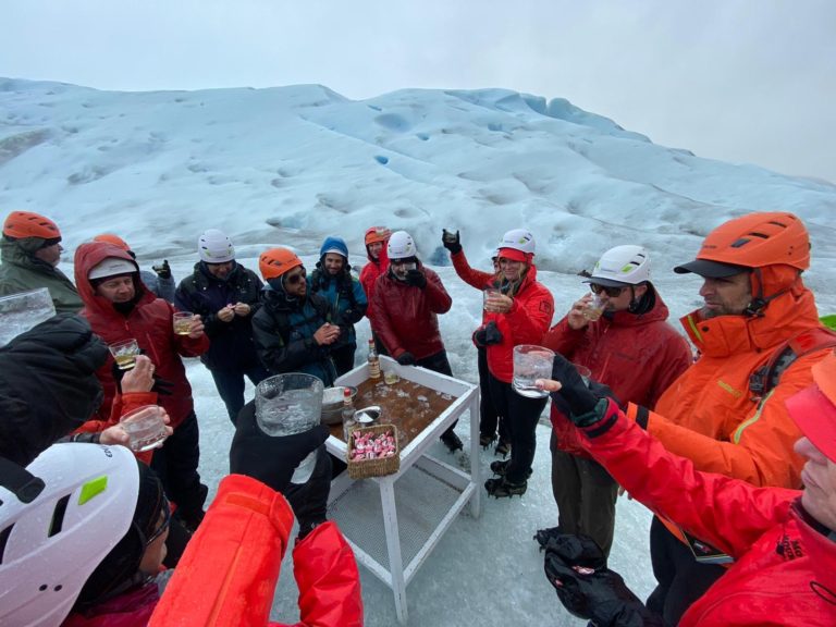 Group celebrating on Perito Moreno Glacier in Patagonia