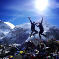 Two people jumping at the Everest Base Camp