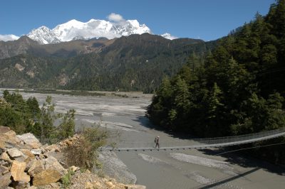 A Foot bridge crossing over a large river