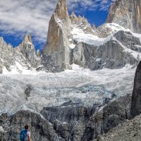 A hiker admires some mountain spires in Patagonia