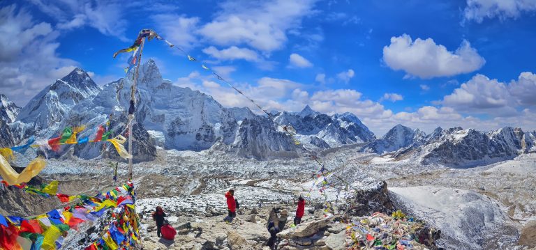 View of Mount Everest and Nuptse with buddhist prayer flags from kala patthar in Sagarmatha National Park in the Nepal Himalaya