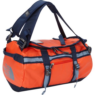 An orange North Face duffel bag