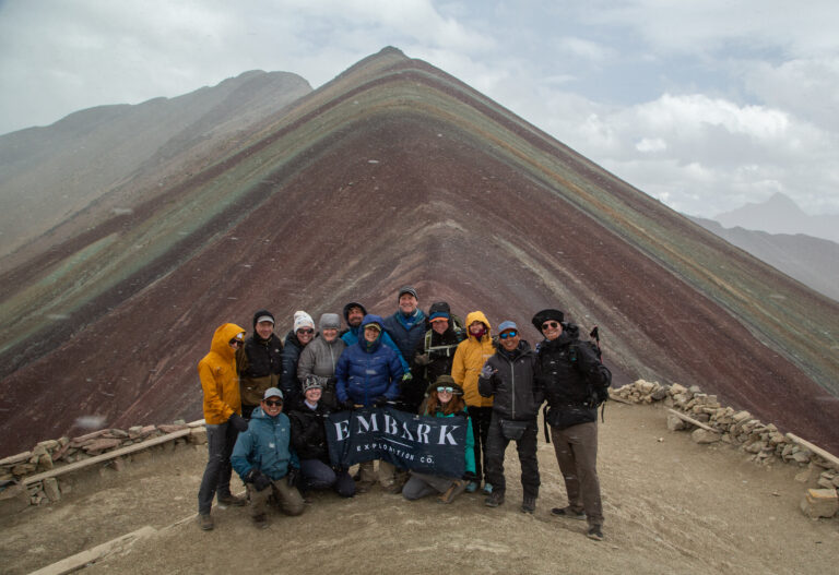 Group of hikers enjoying a scenic viewpoint on the trek